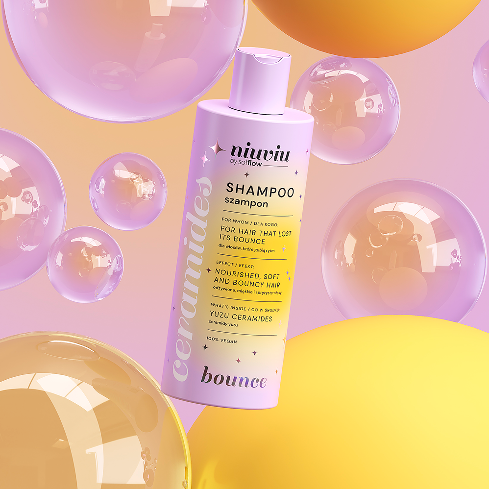 Szampon niuviu Bounce z ceramidami yuzu w fioletowym opakowaniu, otoczony kolorowymi bąbelkami.